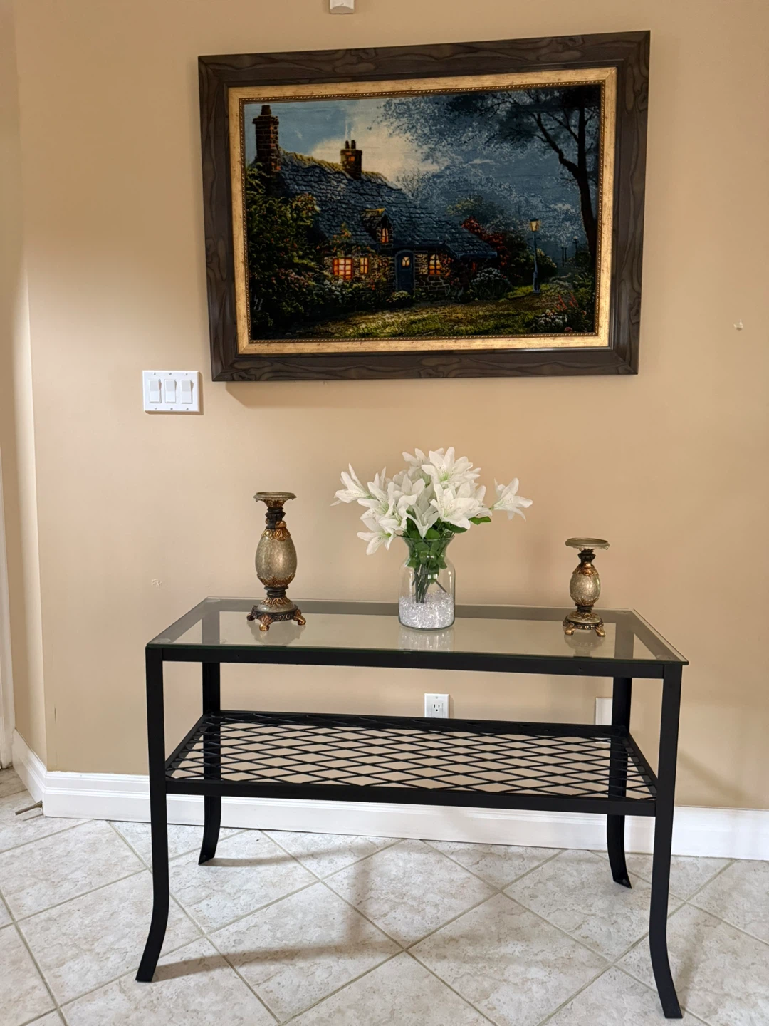 Glass top console table with black metal frame