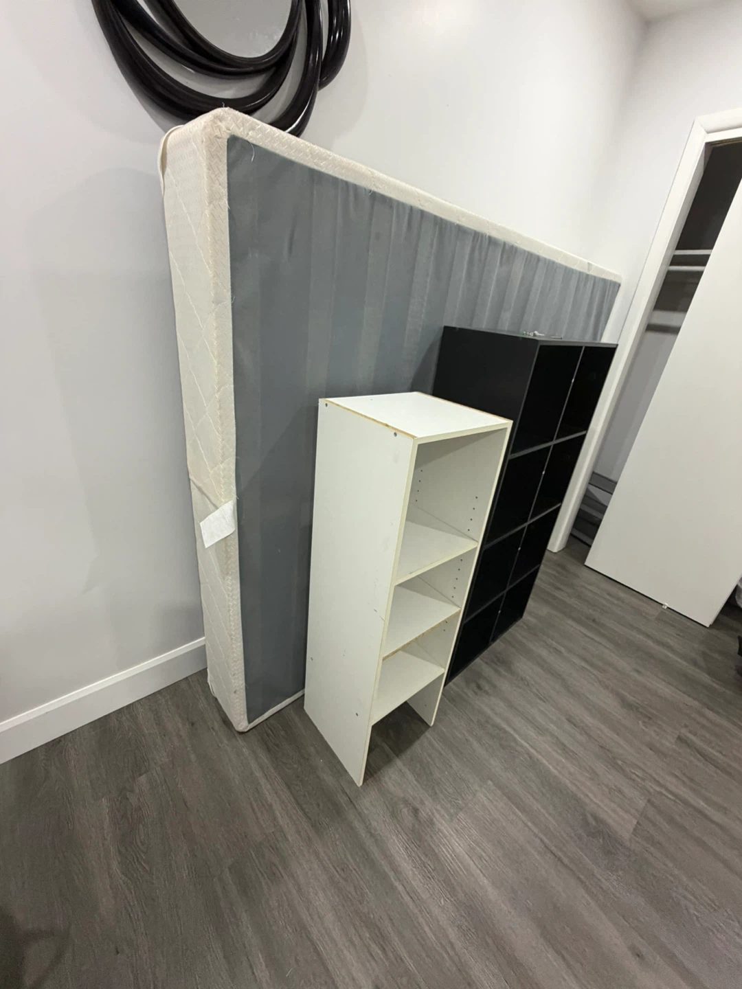 Black Cube Storage Unit and White Shelf Unit