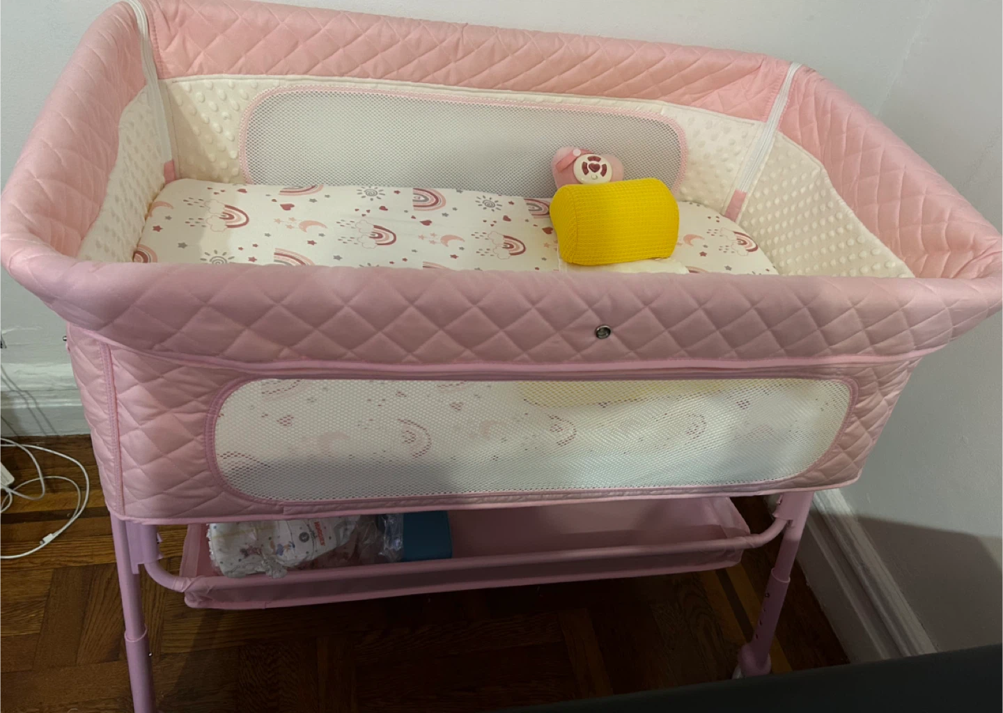 Pink Baby Bassinet with Rainbow Print Mattress