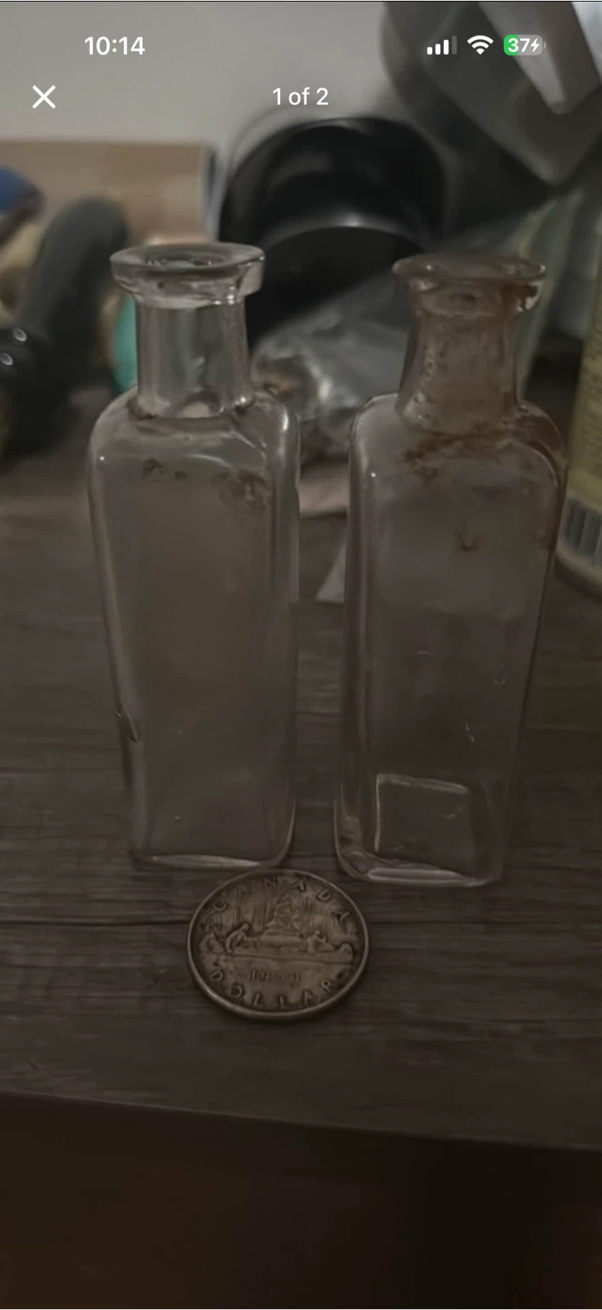 Two Dalley glass bottles