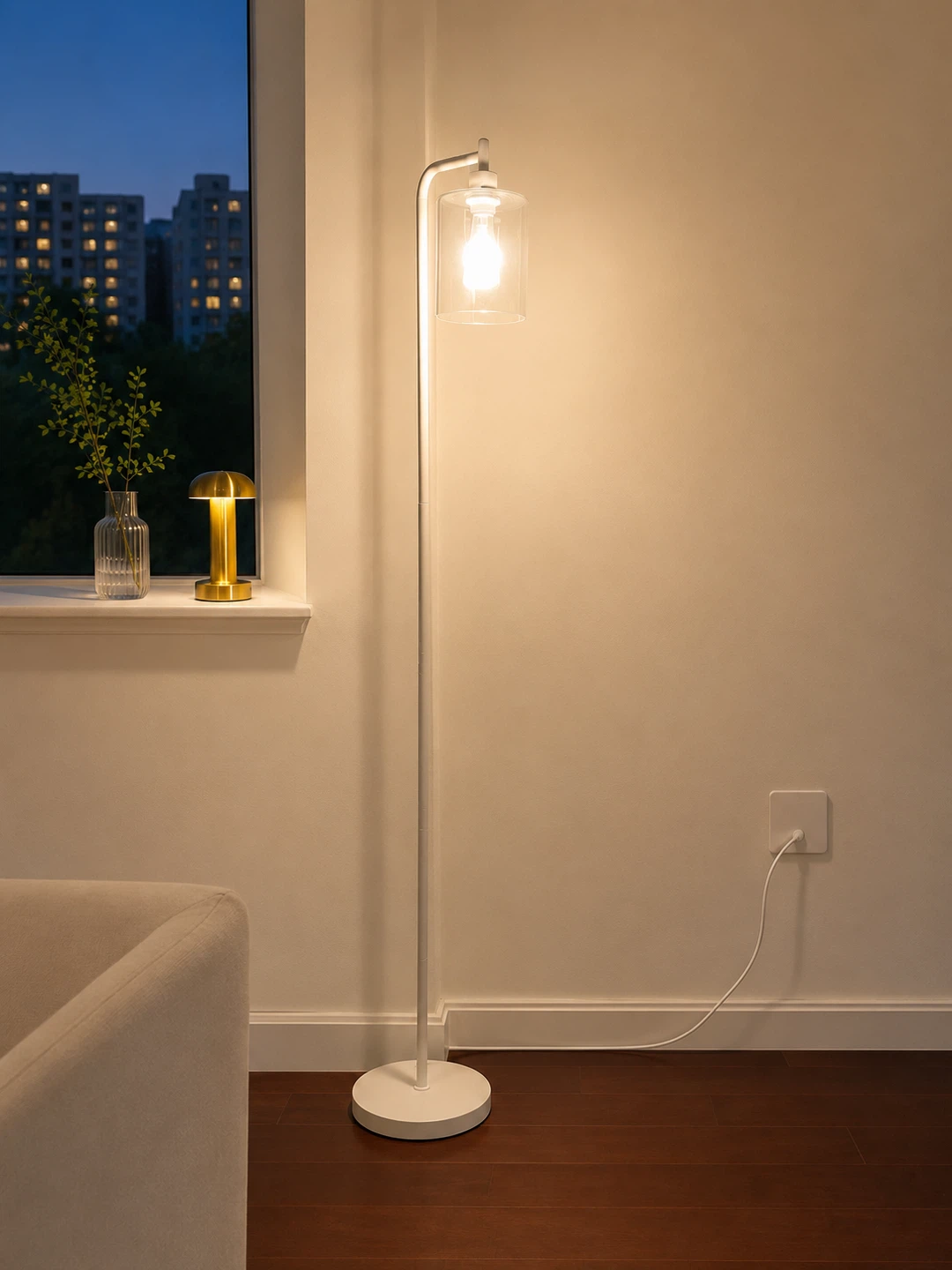 White floor lamp with a clear glass shade