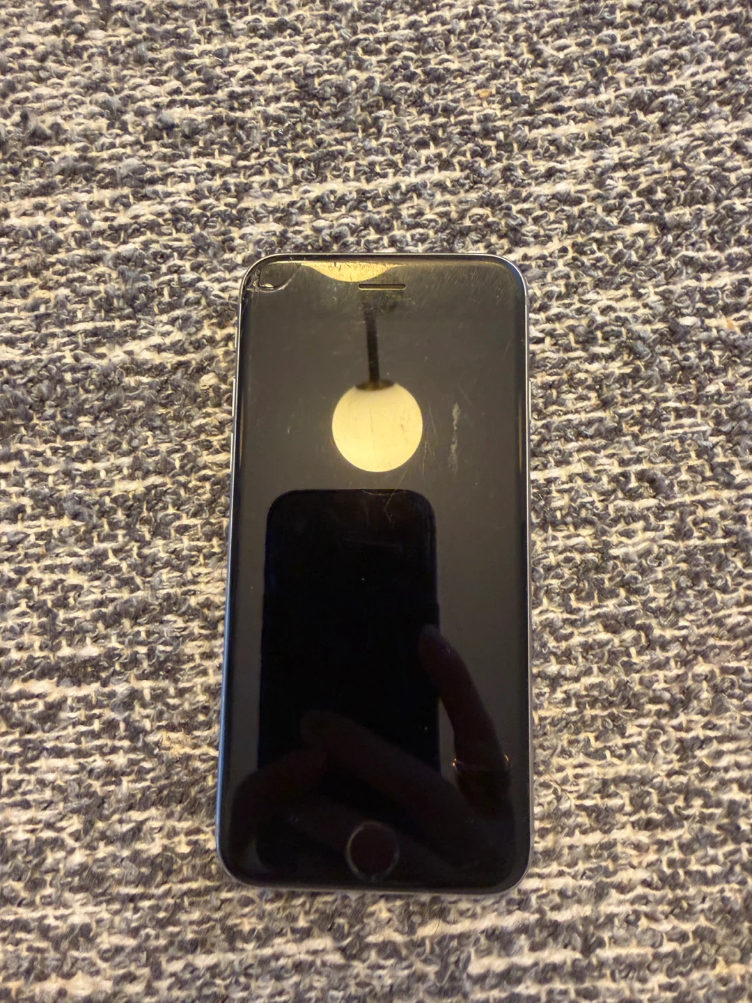 iPhone S cracked screen top left corner
