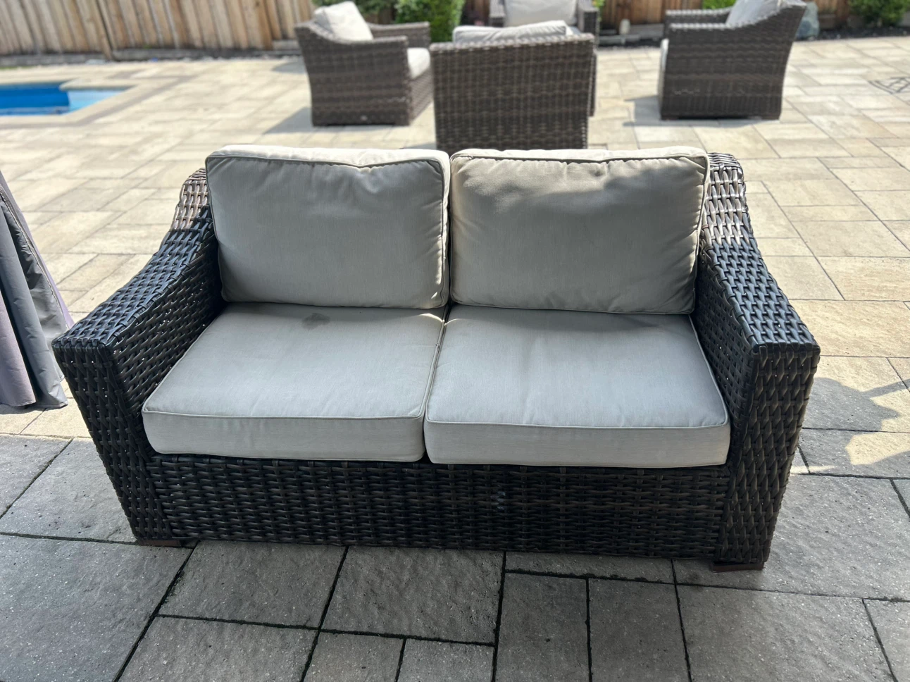 Wicker Loveseat with Light Grey Cushions