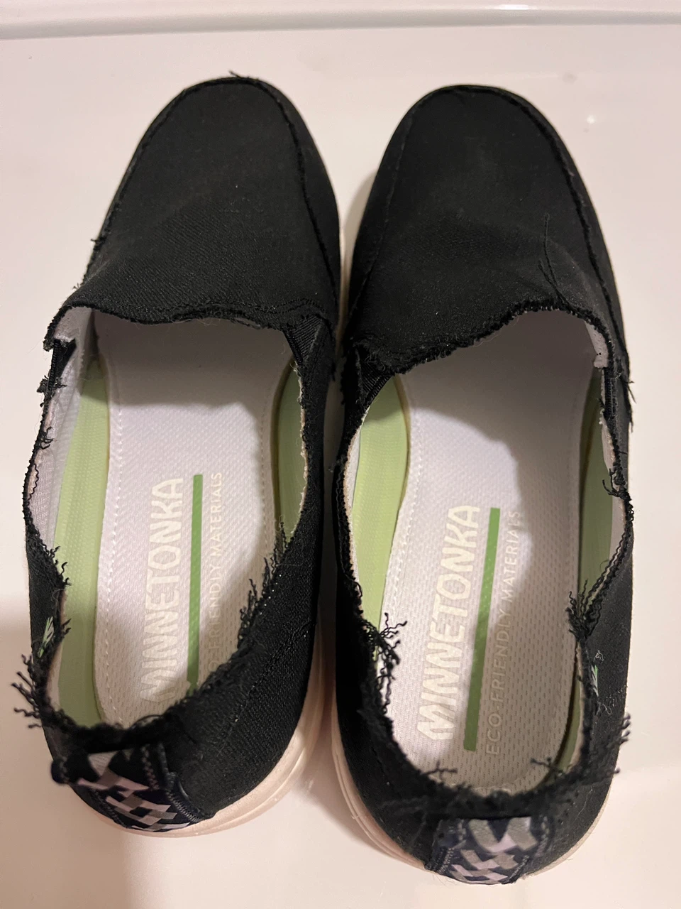 Minnetonka Black Slip-On Canvas Shoes