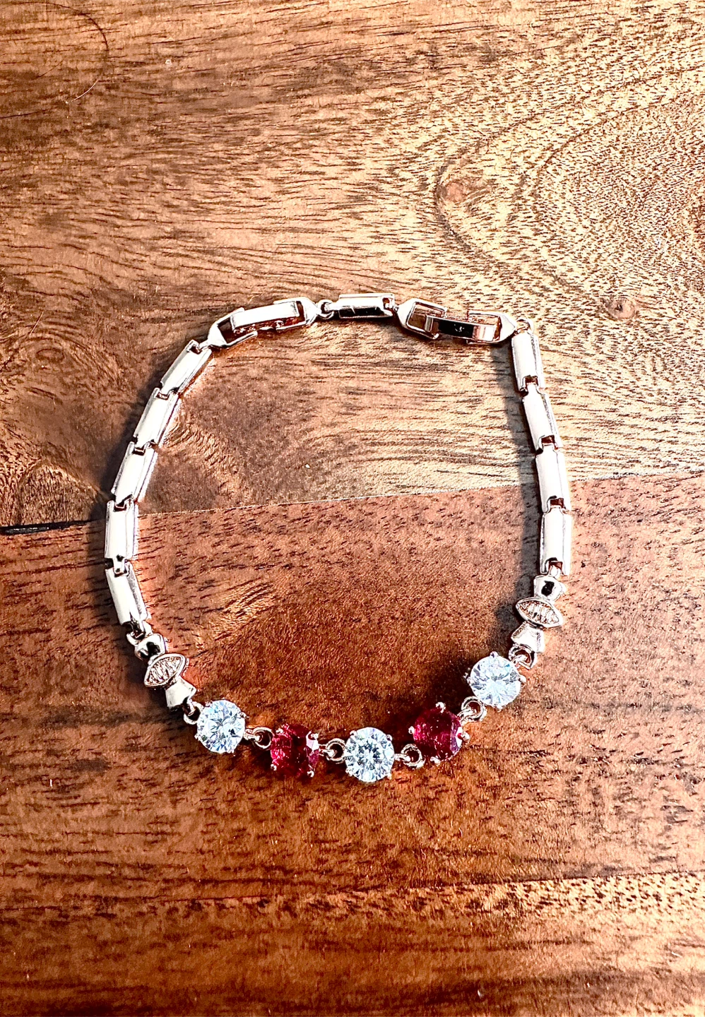 Rose Gold Tone Bracelet with Clear and Red Stones