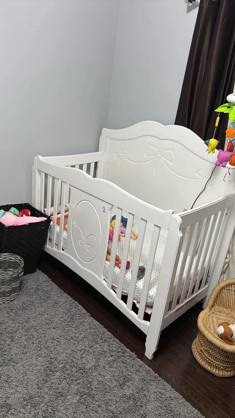 White Baby Crib with Bow Detail