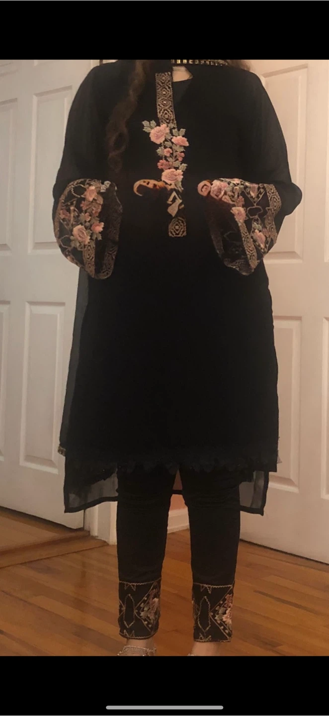 Black embroidered dress with floral accents