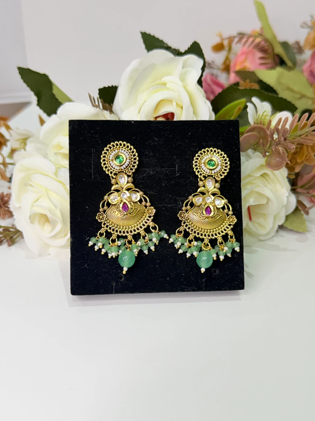 Gold Toned Dangle Earrings with Green Beads