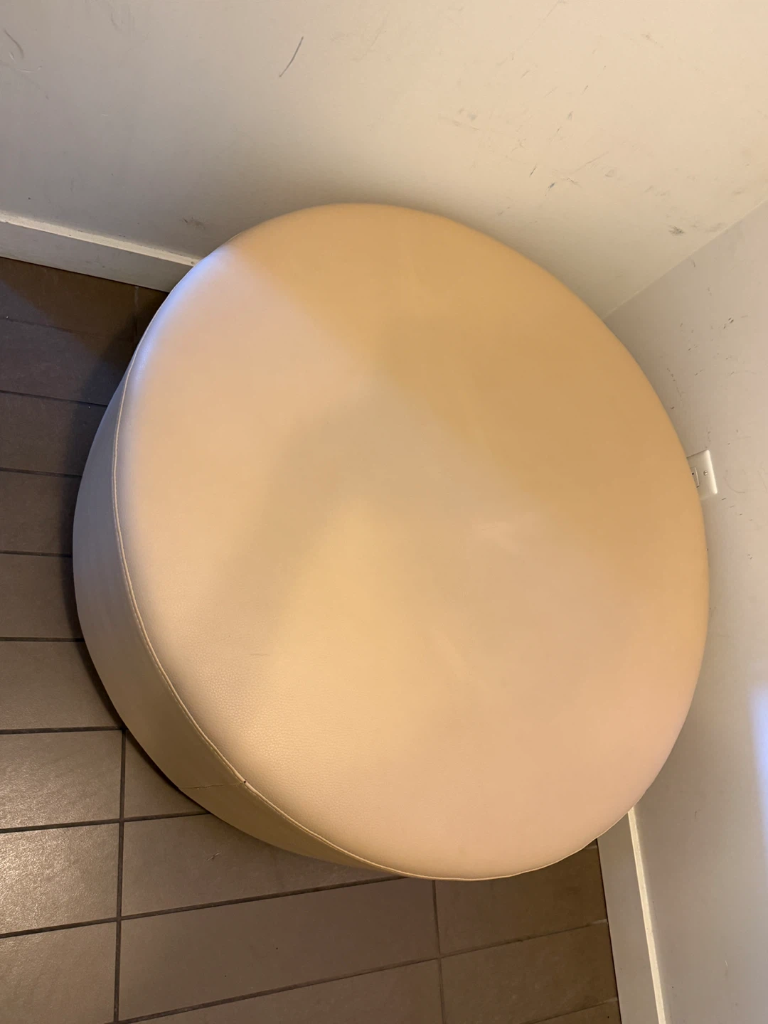 Round Leather Ottoman on wheels
