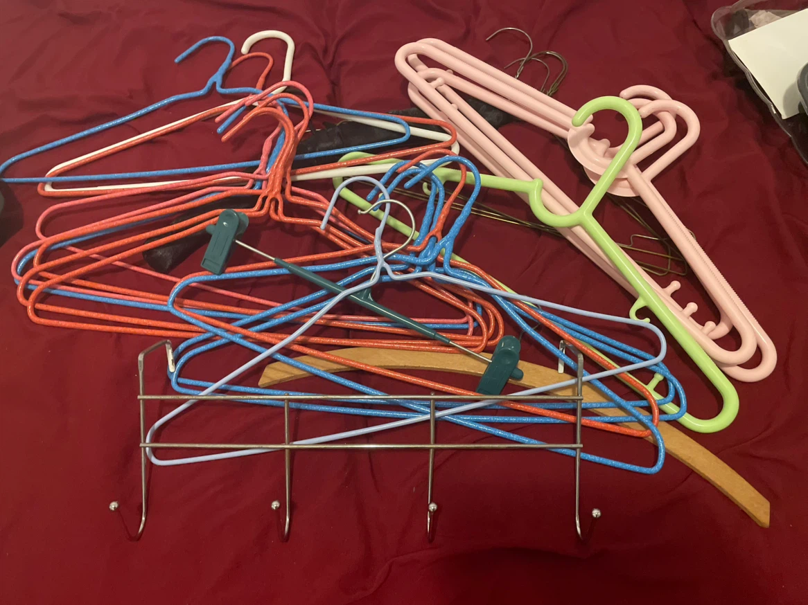 25 Assorted Clothes Hangers and 1 Hook Rack