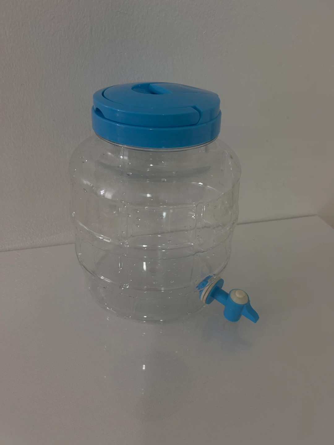 Clear Drink Dispenser with Blue Lid and Tap