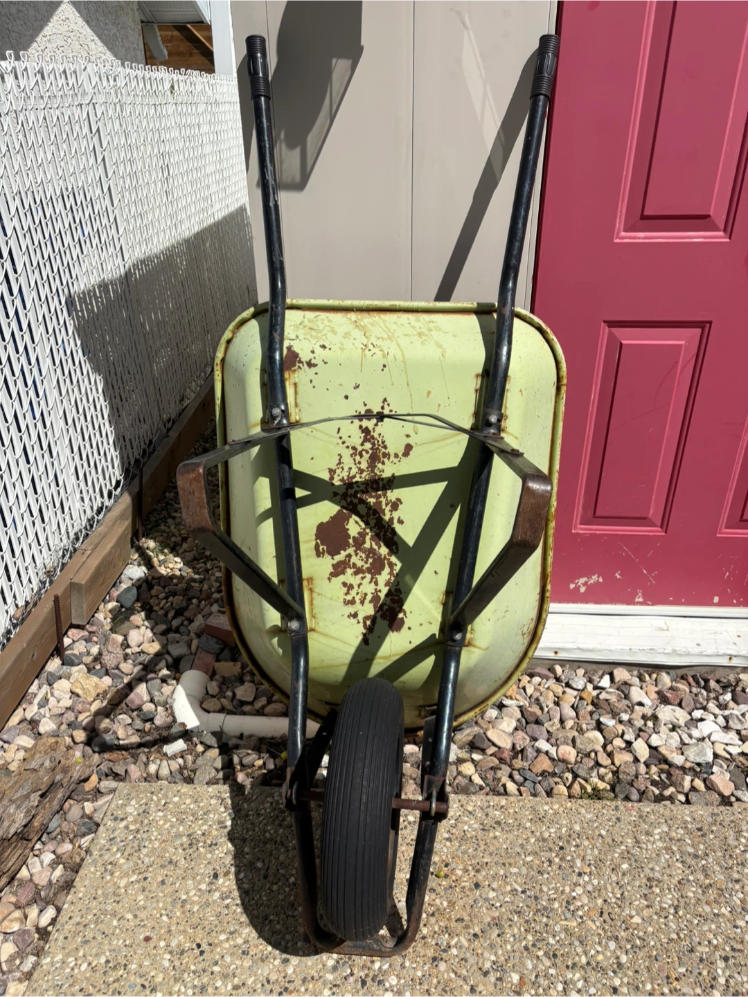 Used Green Metal Wheelbarrow
