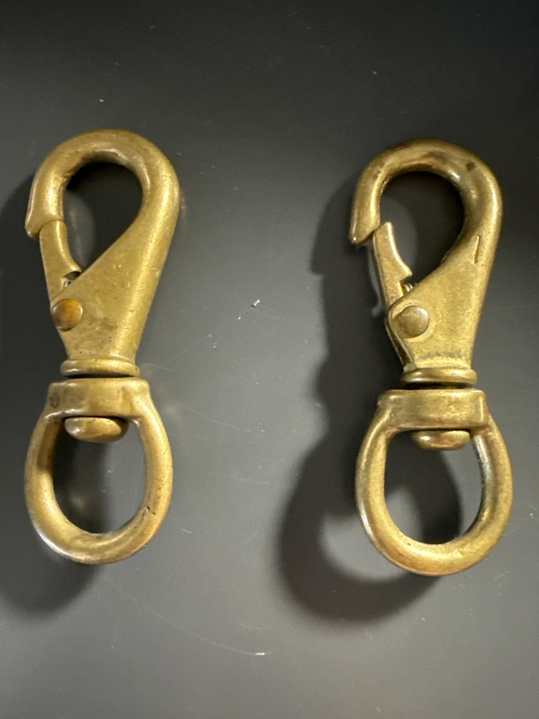 Two Brass Swivel Snaps