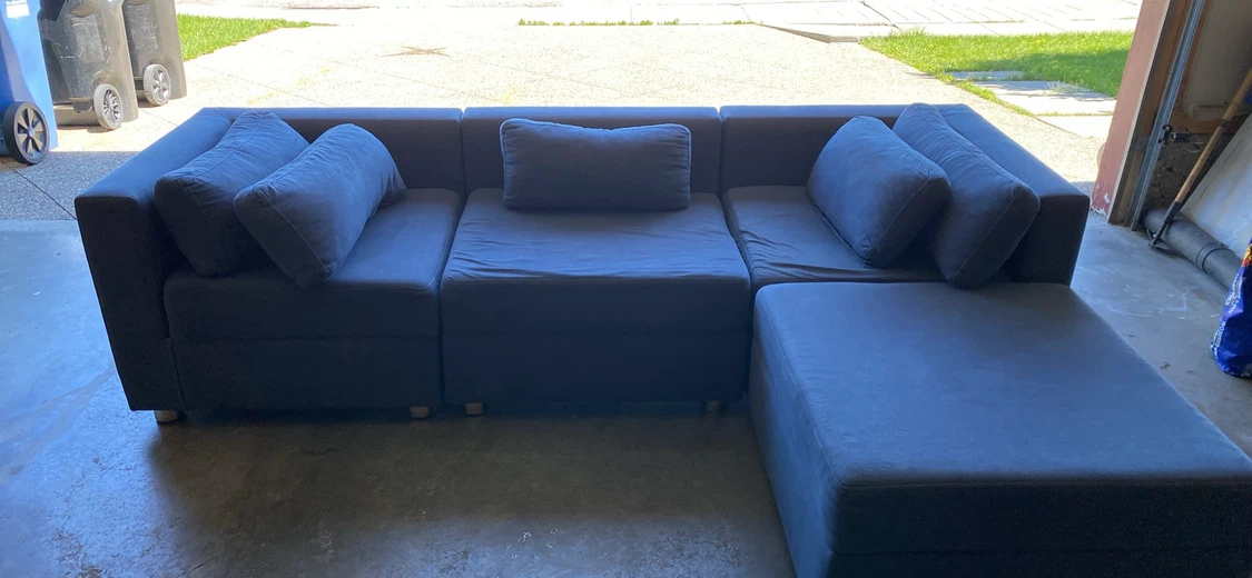 L shape Blue sectional sofa with ottoman