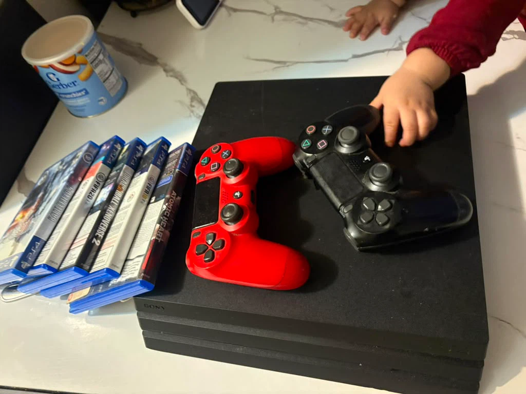 PlayStation 4 Console with 5 Games and 2 Controllers