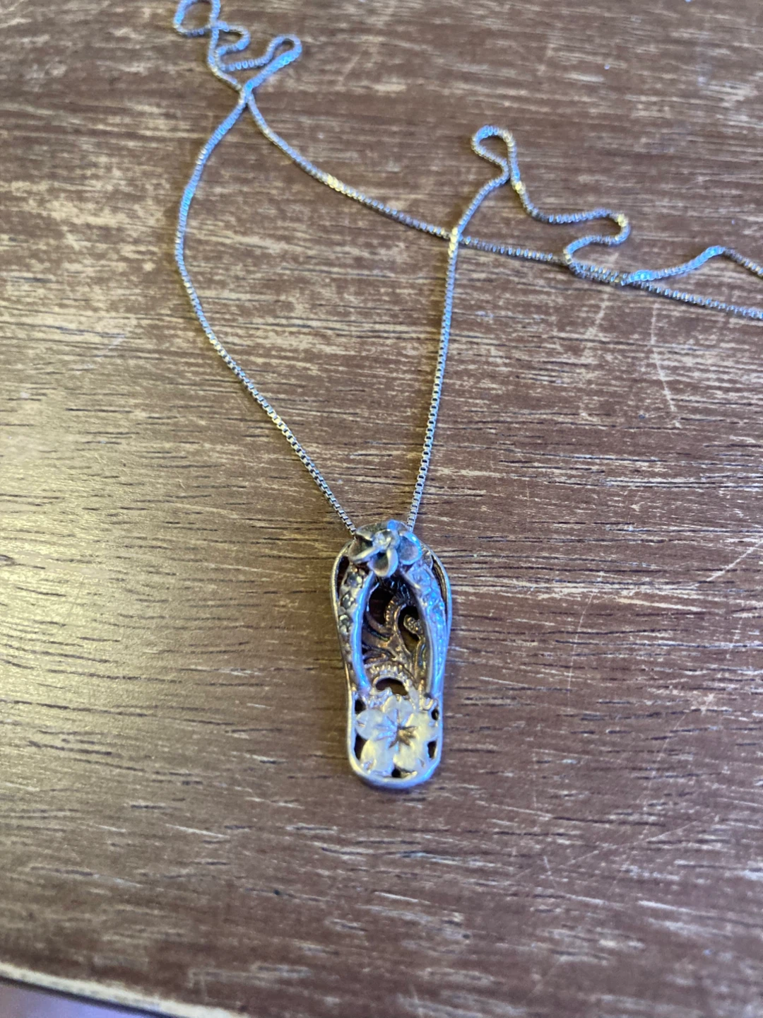 Sterling silver Hawaiian sandal on 16” chain