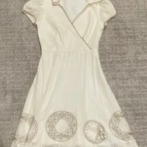 White Wrap Dress with Embroidered Details