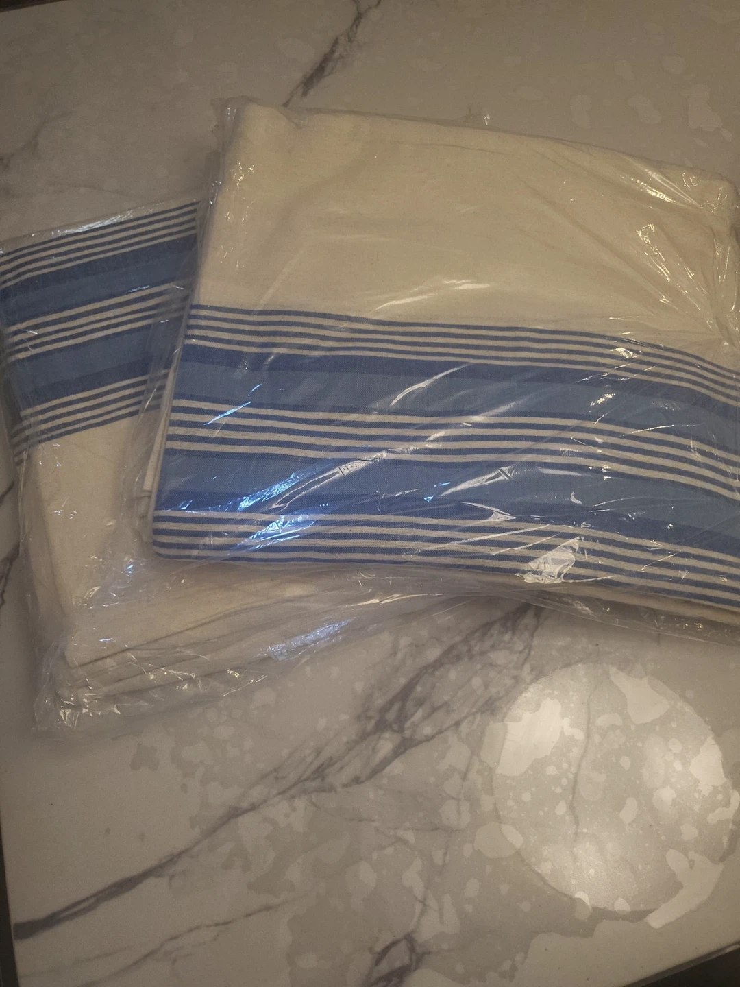 Flat sheet, 60" x 84" twin, 80% cotton, 20% polyester.