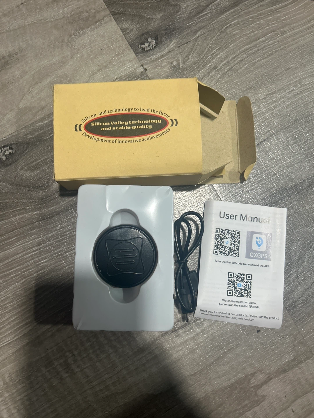 QXGPS Tracking Device with Charging Cable and User Manual