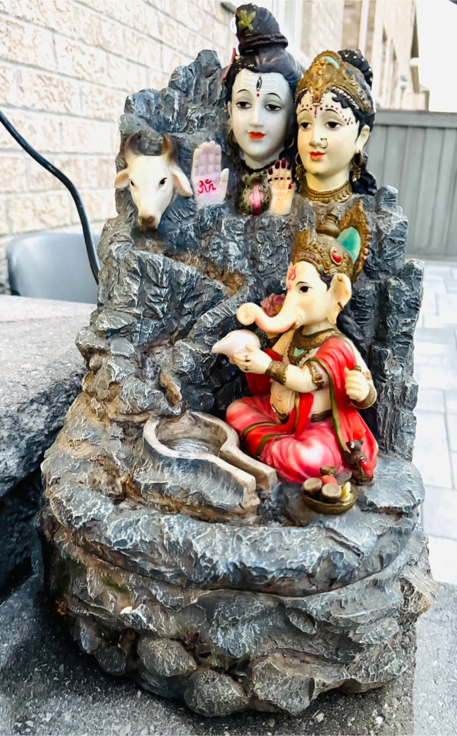 Water fall with Ganesha, Shiv ji & Parvati’s Statue