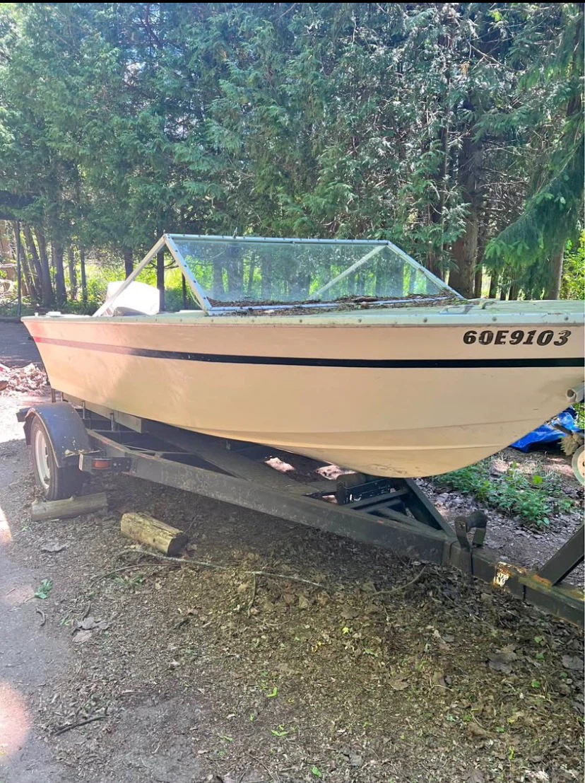 2 boats with trailers, engines, engine hoist/stand.