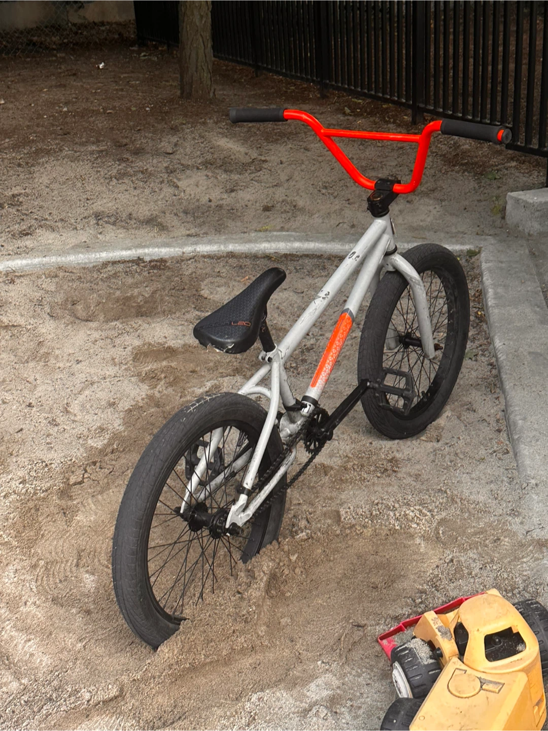 Grey BMX Bike with Orange Handlebars