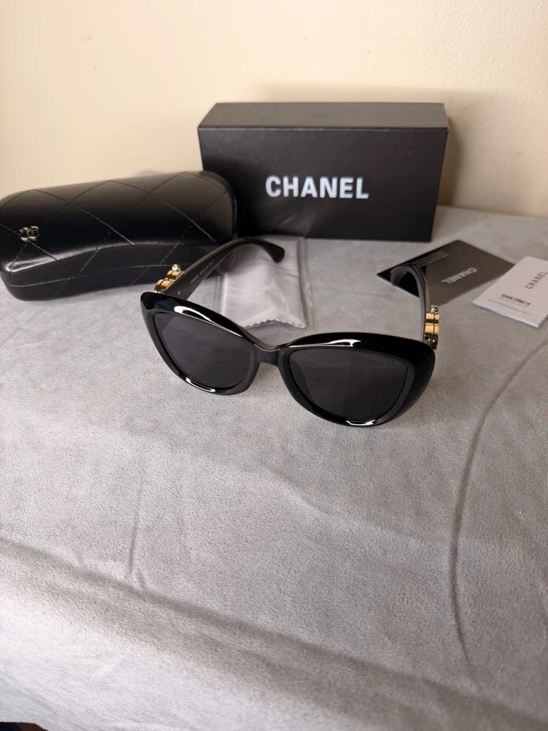 CHANEL Black Cat-Eye Sunglasses with Gold Heart Detail