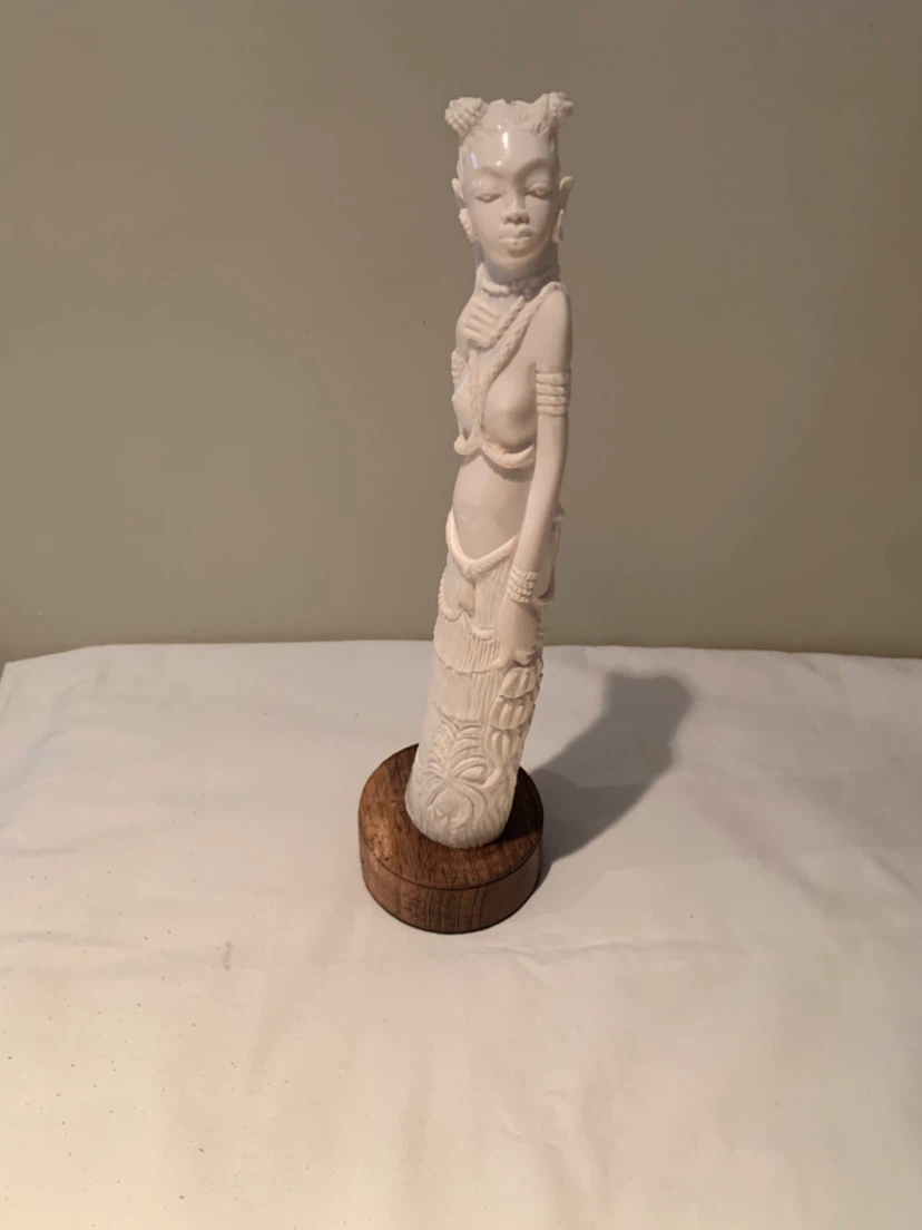 Decorative Carved Figurine on Wooden Base