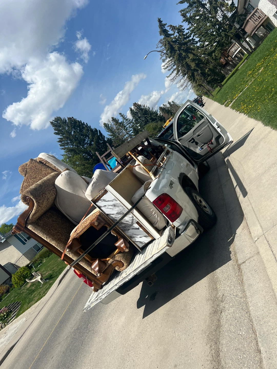 Assorted Furniture Pieces in Truck Bed