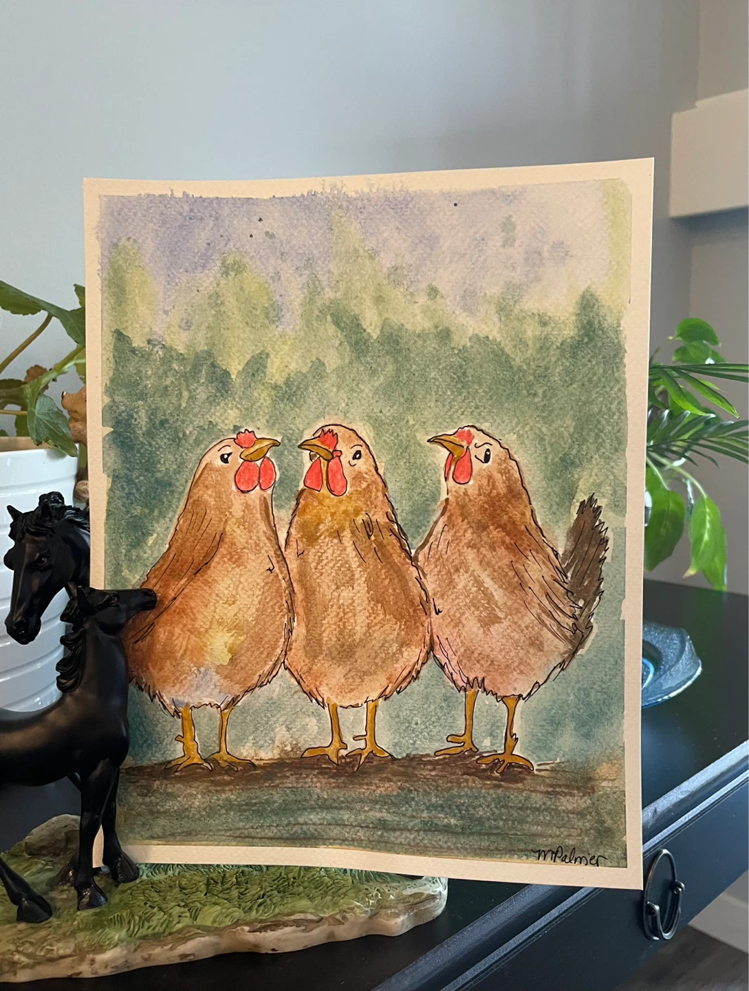 Watercolor painting of three chickens