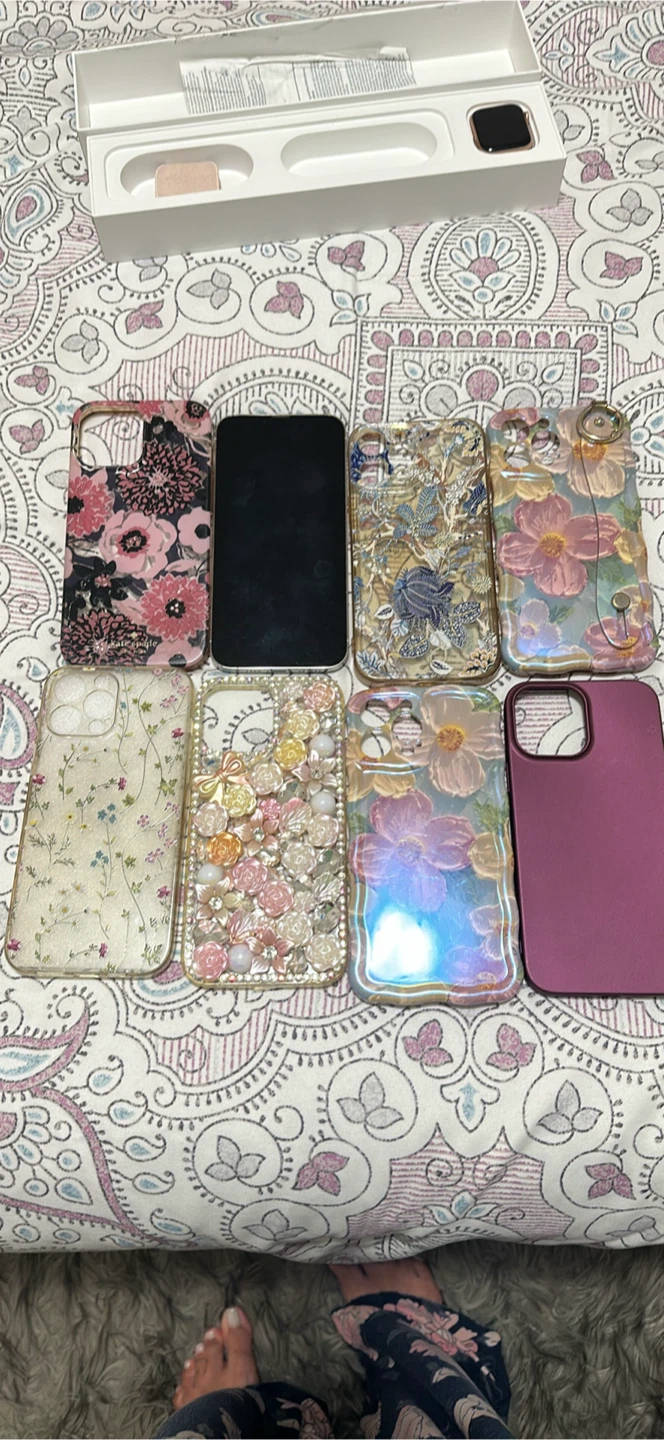 iPhone white 13 pro Max with 7 cases