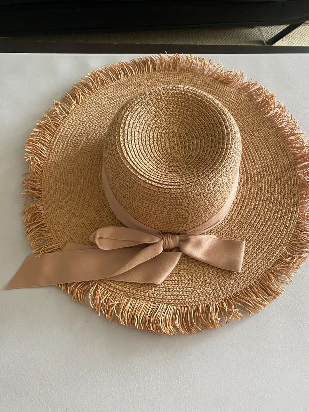 Straw sun hat with fringe and ribbon bow