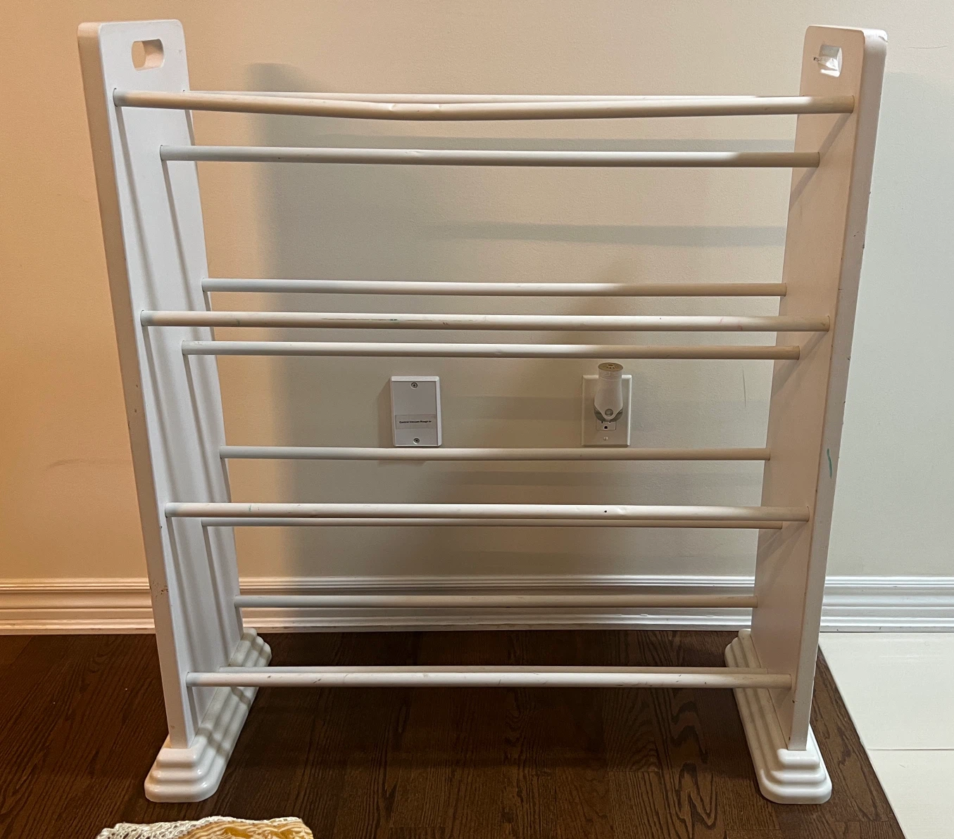 White wood and metal rods rack