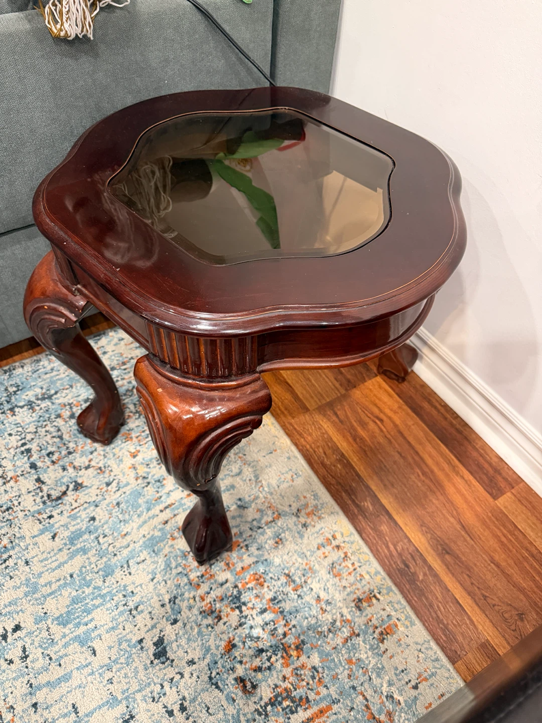 Wooden accent table with glass top