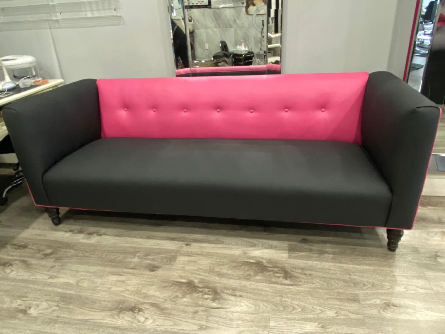 Stylish Reupholstered Black and Pink Sofa