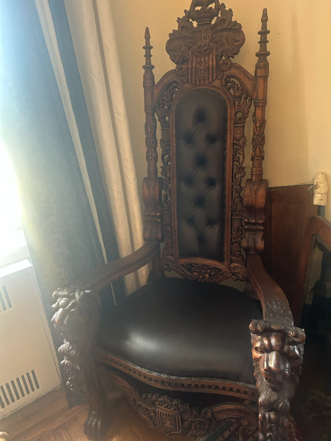 Ornate Wooden Throne Chair with Black Tufted Seat