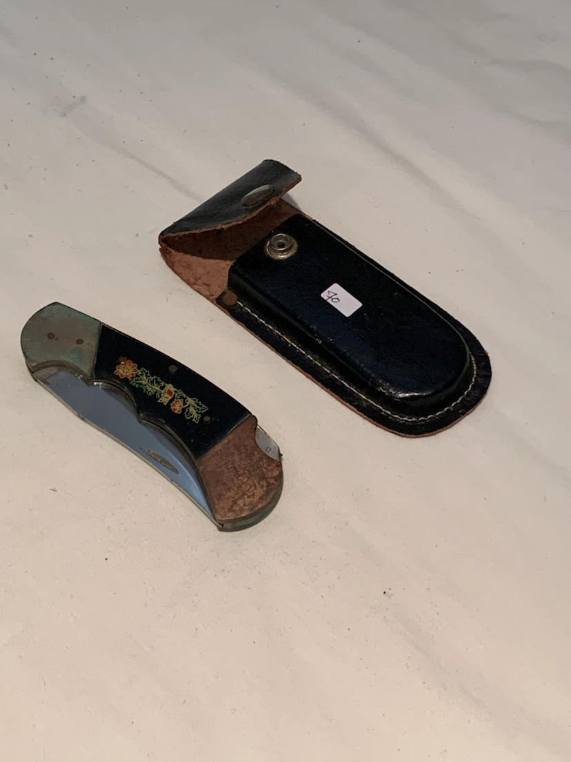 Folding pocket knife with decorative floral inlay