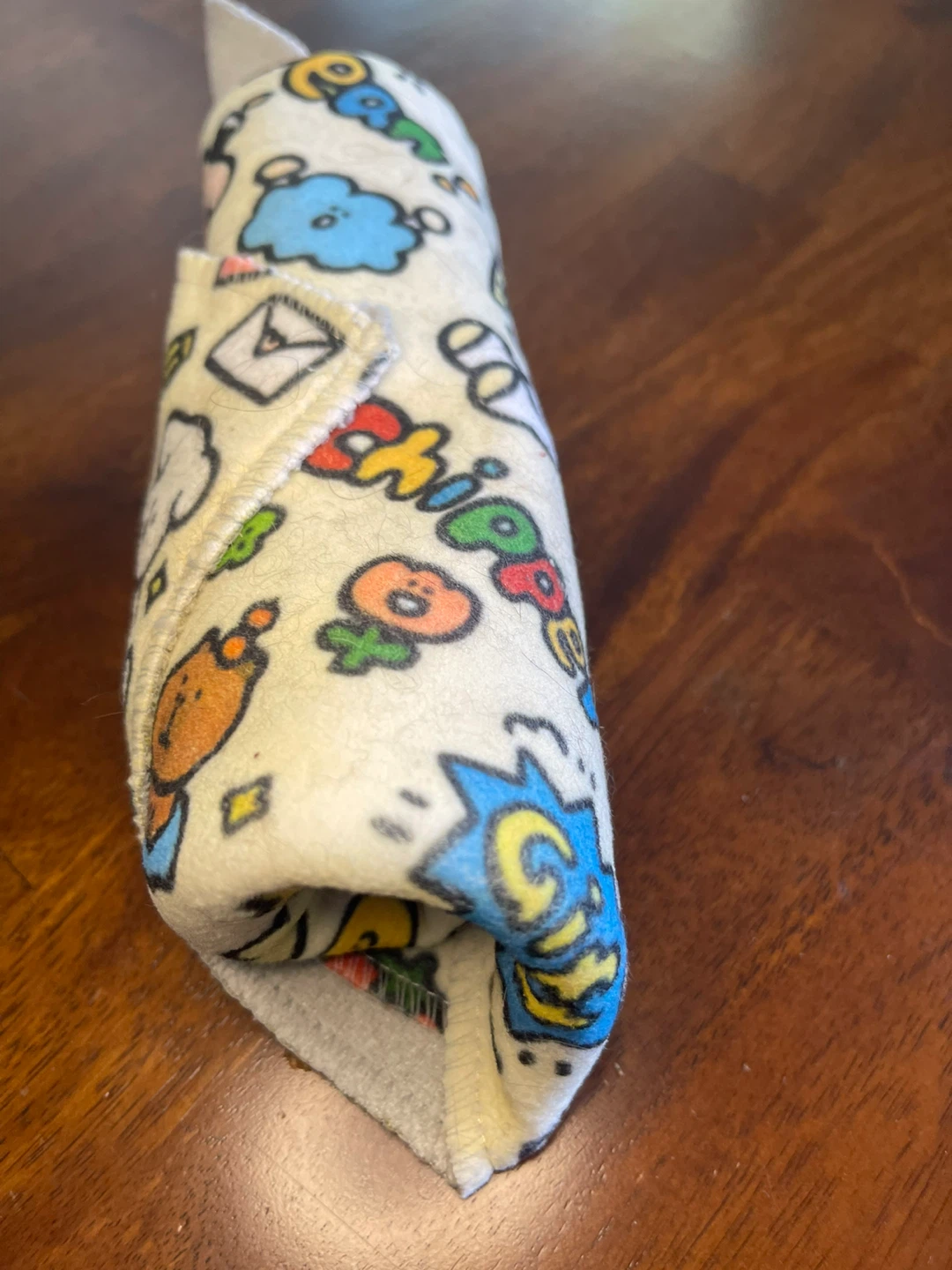 Cat blanket wrap secures cat for grooming -feeding
