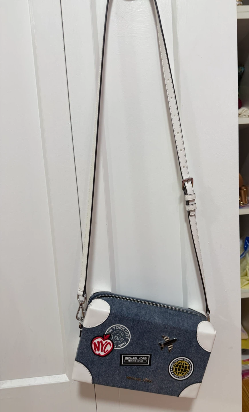 Michael Kors crossbody bag with travel patches