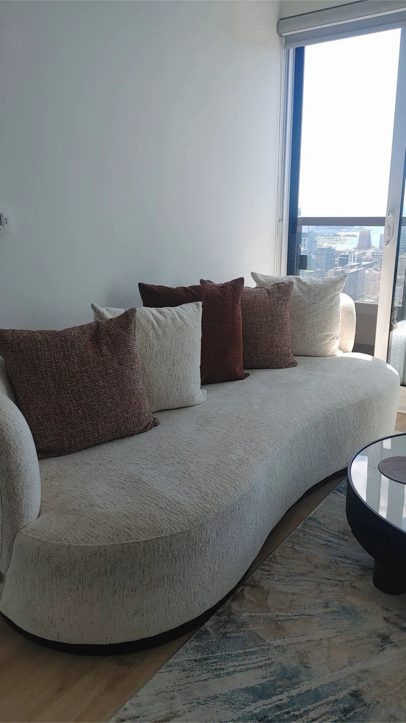 Curved Sofa with Accent Pillows