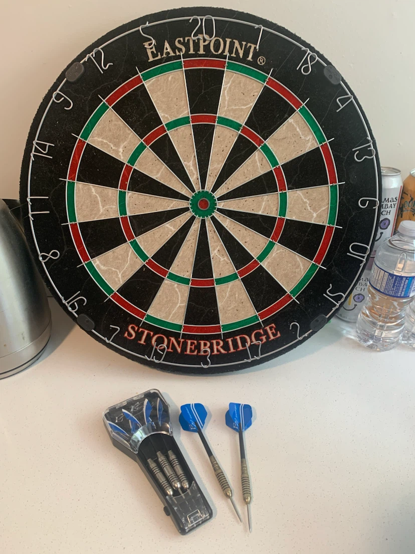 Dart board with darts