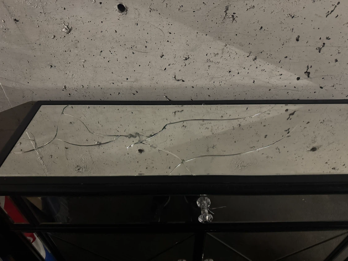 Mirrored cabinet with cracked top