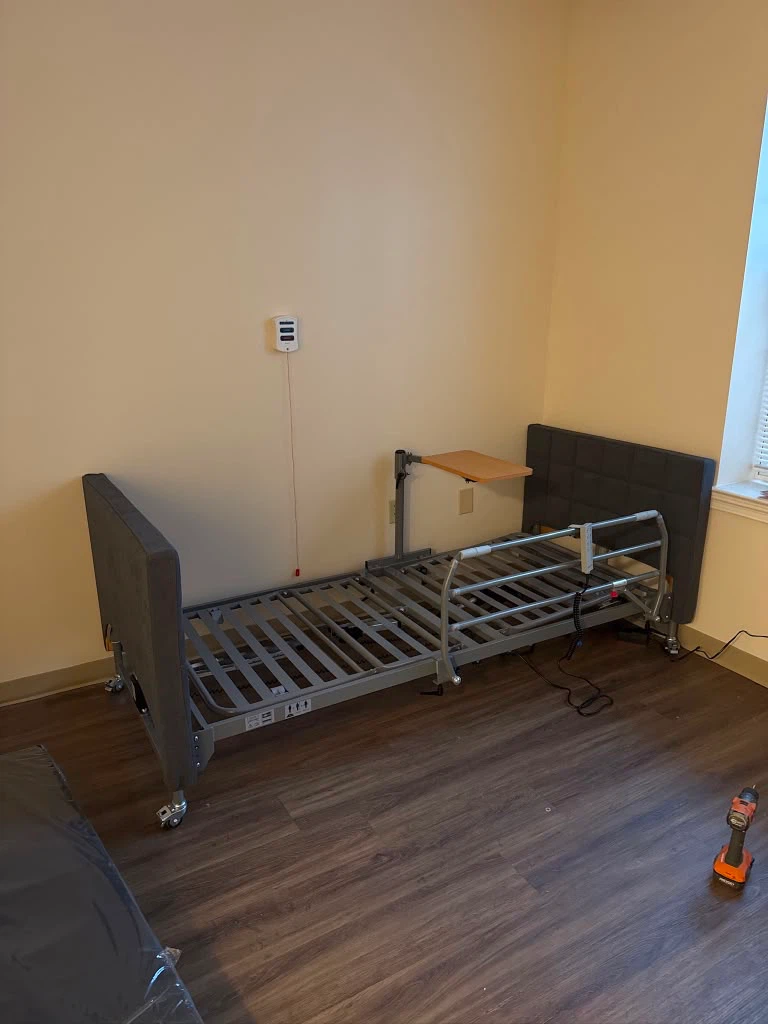 Bed with Overbed Table and Grey Covers - photo 2