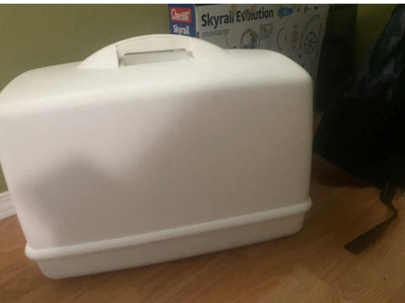 White plastic sewing machine case