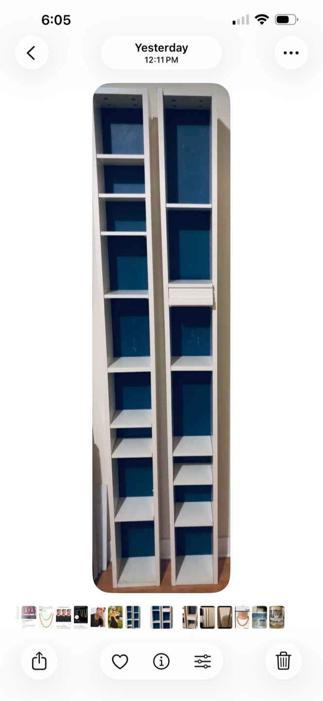Two tall IKEA white units with blue backing