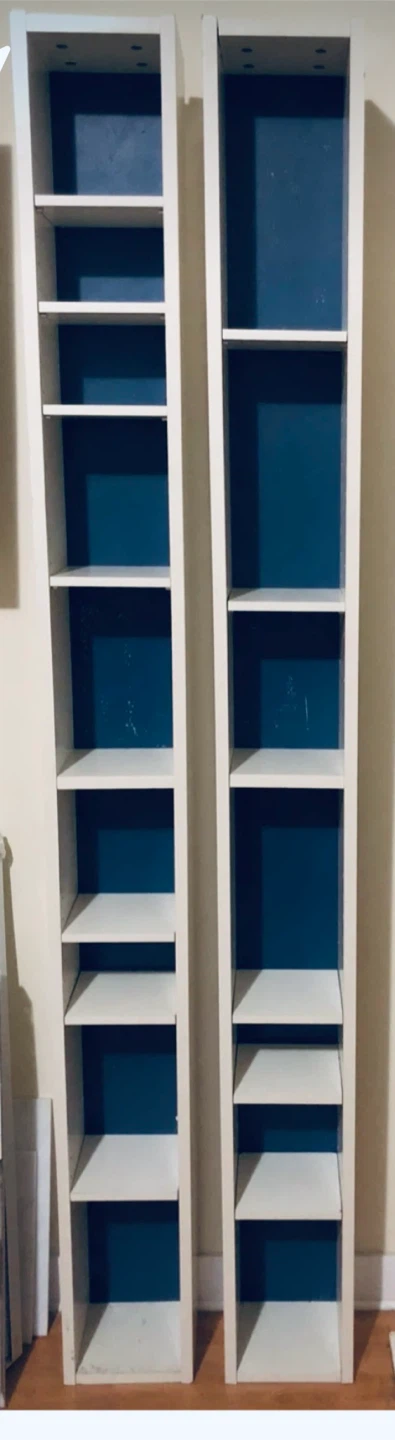 Two tall IKEA white units with blue backing - photo 2
