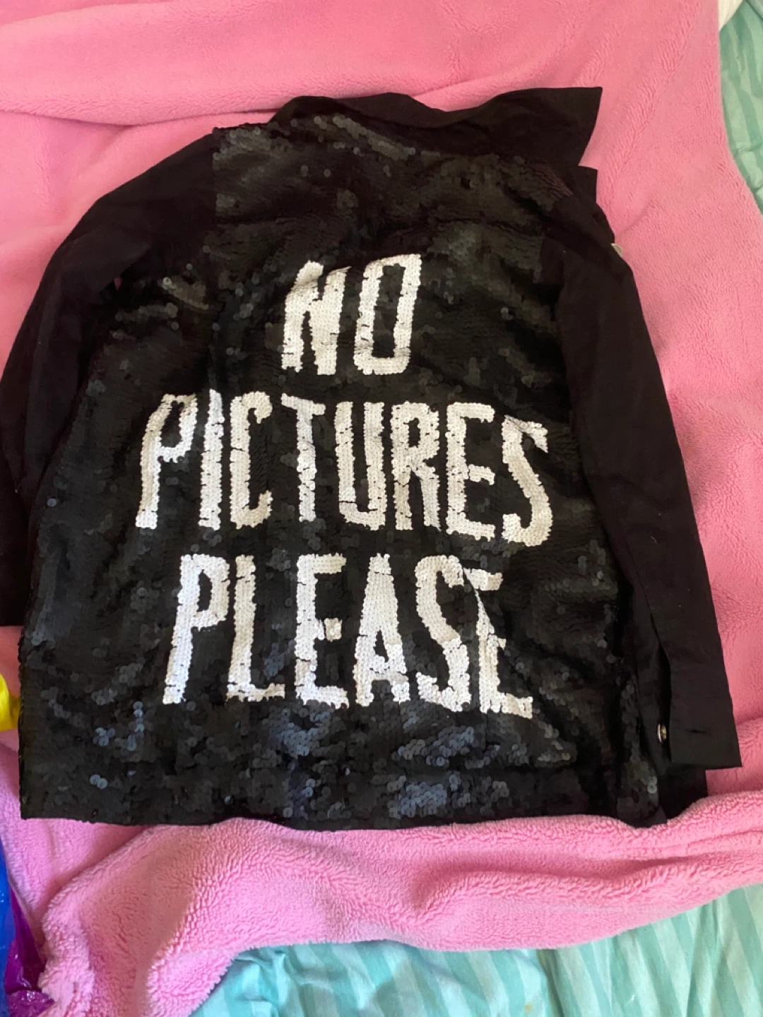 Black sequin jacket with "NO PICTURES PLEASE" text