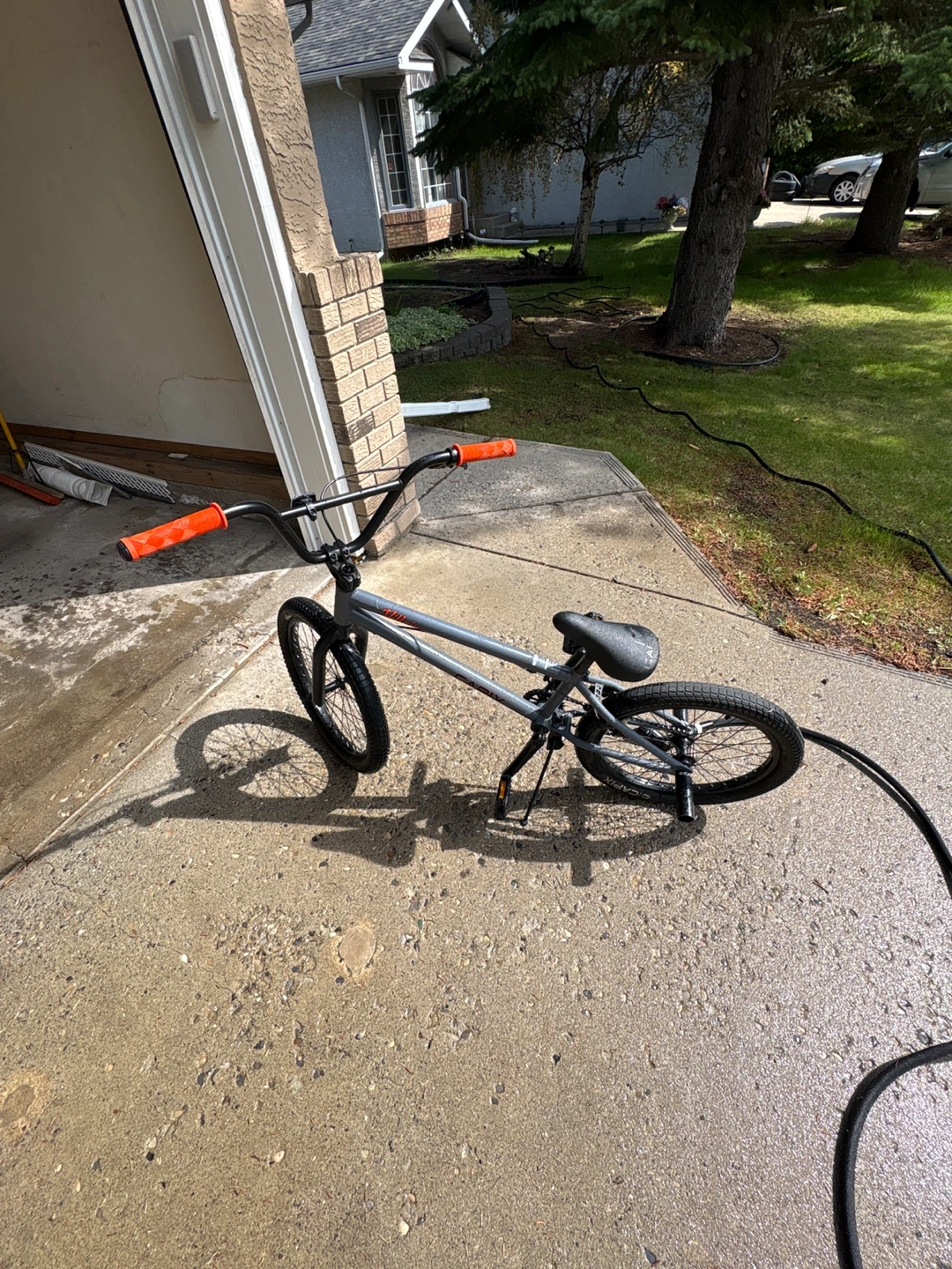 Gray BMX Bike with Orange Grips