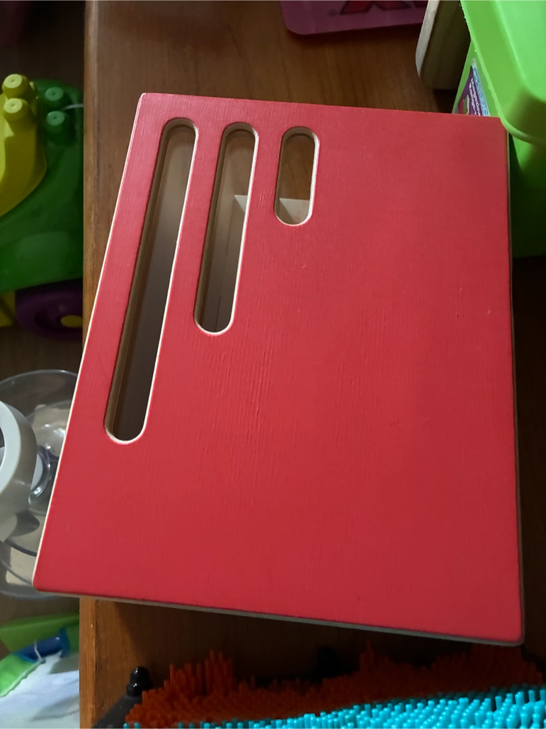 a Lovevery Count & Slide  Chute, a wooden Montessori-style