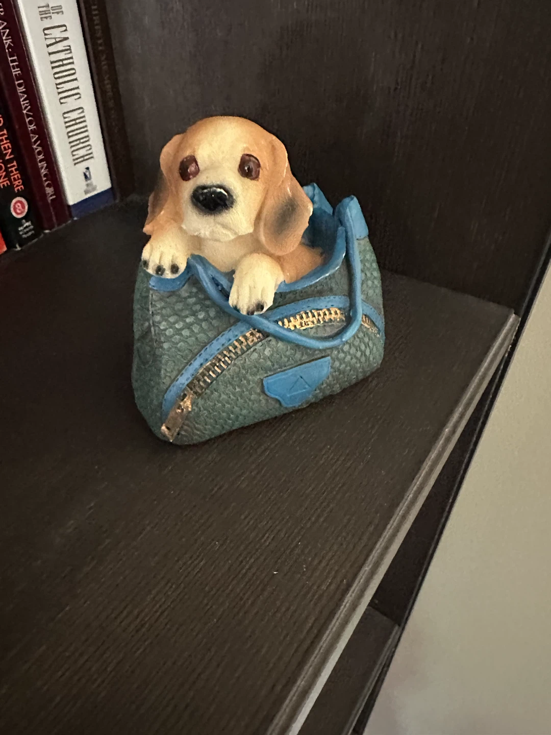 Dog in a Bag Figurine
